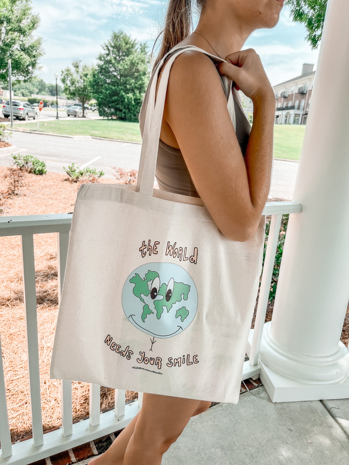 The World Needs Your Smile Tote Bag